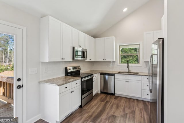 3143 Lee Cir, Buford, GA 30518 - kitchen featuring white cabinets, stainless steel appliances, dark wood-type flooring, a sink, and light stone counters