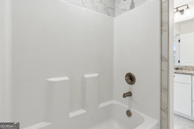 3143 Lee Cir, Buford, GA 30518 - bathroom featuring marble finish floor, bathing tub / shower combination, and vanity