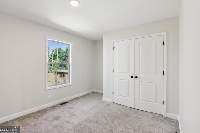 3143 Lee Cir, Buford, GA 30518 - unfurnished bedroom with a closet, carpet floors, visible vents, and baseboards