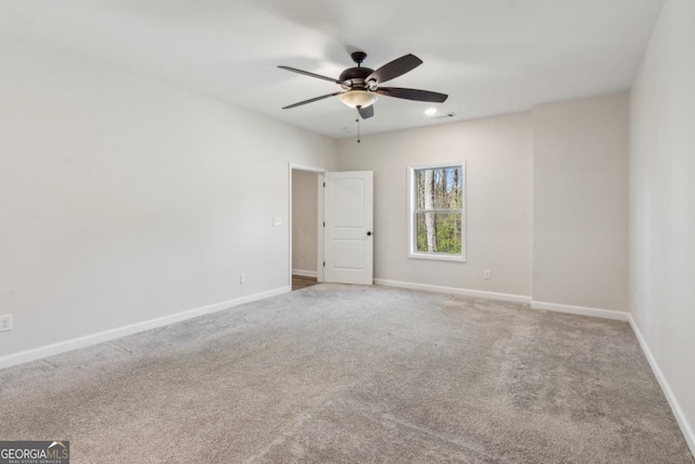 3143 Lee Cir, Buford, GA 30518 - spare room featuring baseboards, carpet, and a ceiling fan