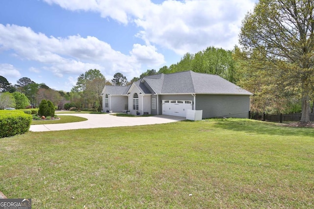 single story home with a front yard, concrete driveway, fence, and an attached garage