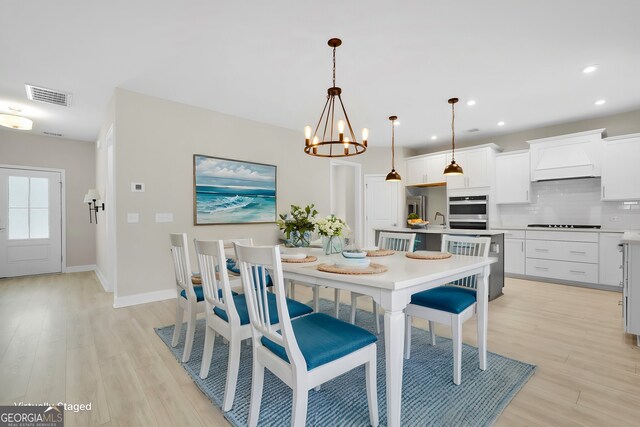 106 Canter Ct, Savannah, GA 31406 - dining area featuring baseboards, an inviting chandelier, recessed lighting, visible vents, and light wood finished floors