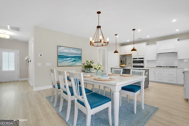 106 Canter Ct, Savannah, GA 31406 - dining area featuring light wood-type flooring, a chandelier, and recessed lighting