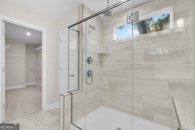 106 Canter Ct, Savannah, GA 31406 - full bath with a stall shower, baseboards, and a walk in closet