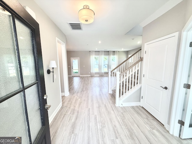 106 Canter Ct, Savannah, GA 31406 - foyer with visible vents, baseboards, light wood-style floors, and stairs