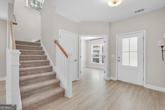 106 Canter Ct, Savannah, GA 31406 - entryway featuring visible vents, baseboards, light wood-type flooring, and stairs