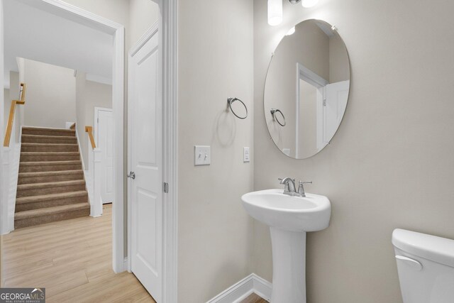 106 Canter Ct, Savannah, GA 31406 - half bath featuring toilet, wood finished floors, and baseboards