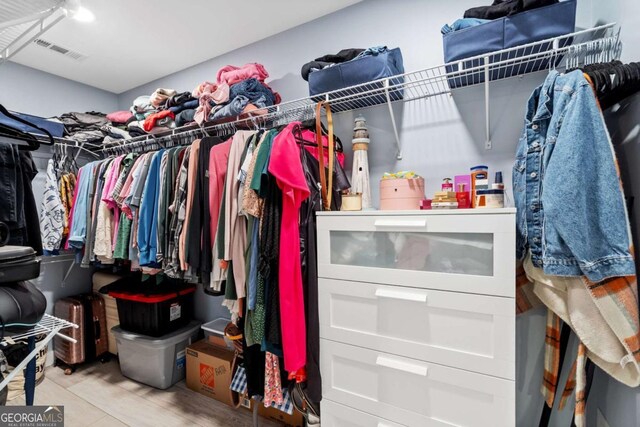walk in closet with visible vents