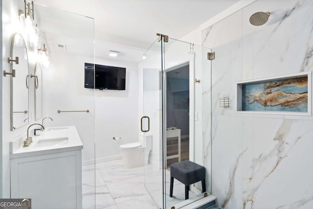 full bathroom featuring a sink, marble finish floor, a marble finish shower, and toilet