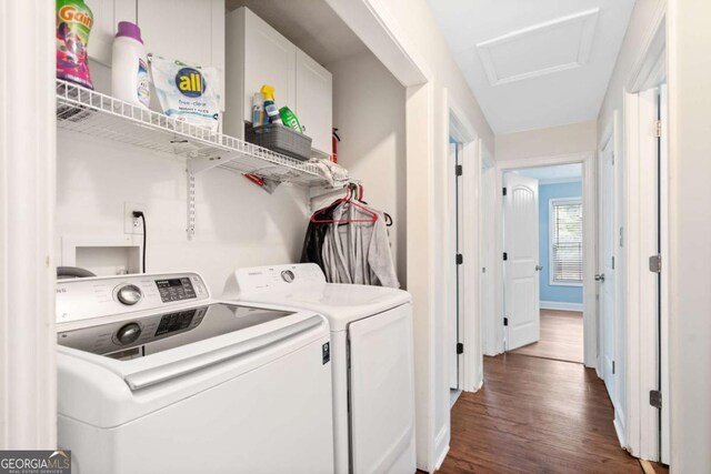 laundry room featuring baseboards, dark wood-style flooring, independent washer and dryer, and laundry area