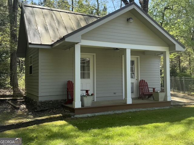 272 Sleepy Hollow Rd, Lafayette, GA 30728 - back of property featuring a standing seam roof, fence, metal roof, a ceiling fan, and a lawn