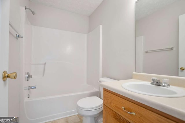 bathroom featuring shower / tub combination, toilet, vanity, and a textured ceiling