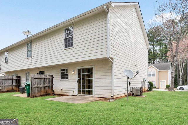 back of house featuring a patio area, central air condition unit, fence, and a lawn