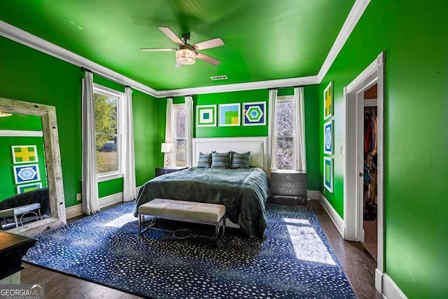 1768 Hood Rd, Dacula, GA 30019 - bedroom with crown molding, baseboards, wood finished floors, and a ceiling fan