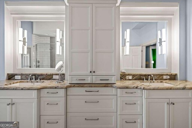 1768 Hood Rd, Dacula, GA 30019 - bathroom featuring a stall shower and double vanity