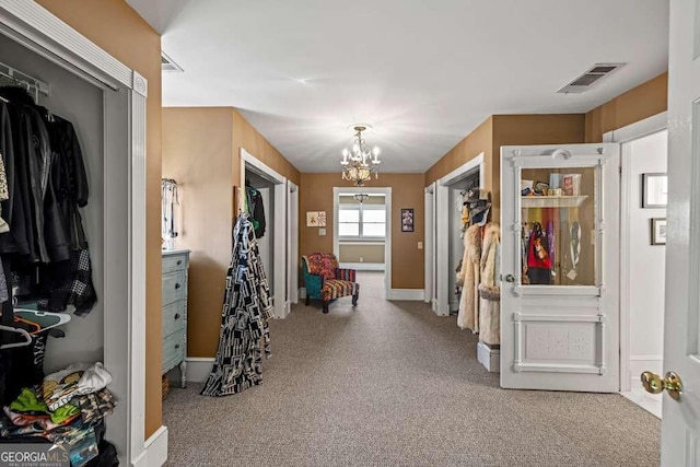 1768 Hood Rd, Dacula, GA 30019 - corridor with a chandelier, carpet flooring, and baseboards