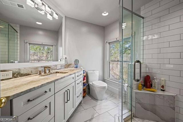 1768 Hood Rd, Dacula, GA 30019 - full bath featuring marble finish floors, vanity, toilet, a shower stall, and tile walls