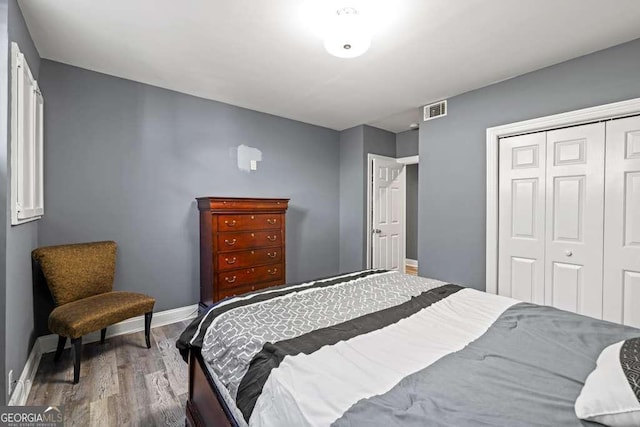 1768 Hood Rd, Dacula, GA 30019 - bedroom featuring a closet, wood finished floors, and baseboards
