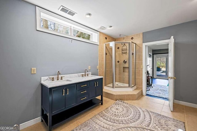 1768 Hood Rd, Dacula, GA 30019 - bathroom featuring a shower stall, tile patterned floors, baseboards, and double vanity