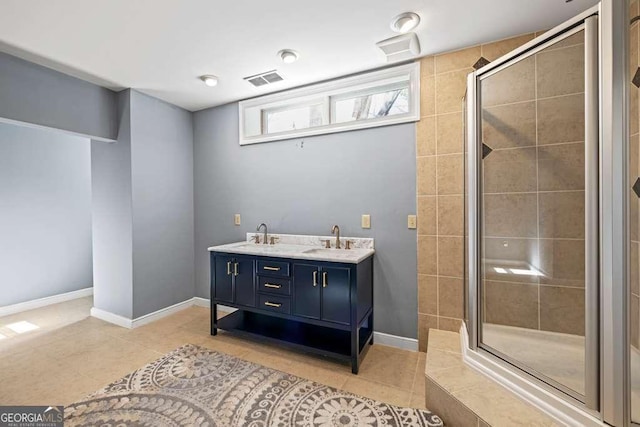 1768 Hood Rd, Dacula, GA 30019 - bathroom featuring a stall shower, tile patterned floors, double vanity, and baseboards
