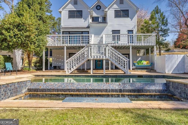 1768 Hood Rd, Dacula, GA 30019 - rear view of house with an outdoor pool, a wooden deck, and stairs