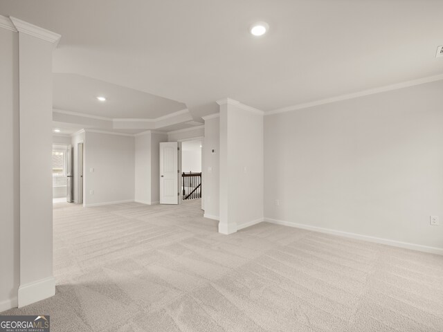 spare room with light carpet, baseboards, ornamental molding, and recessed lighting