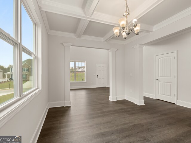 unfurnished dining area with decorative columns, dark wood finished floors, baseboards, beamed ceiling, and an inviting chandelier