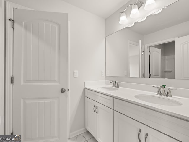 3740 Near Star Ln, Cumming, GA 30028 - full bath featuring marble finish floor, double vanity, baseboards, and a sink