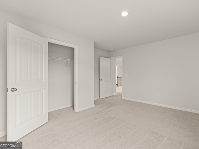 3740 Near Star Ln, Cumming, GA 30028 - unfurnished bedroom with baseboards, a closet, and light carpet