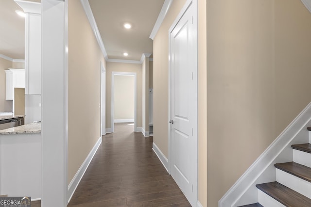hallway with baseboards, ornamental molding, recessed lighting, stairway, and dark wood-style floors