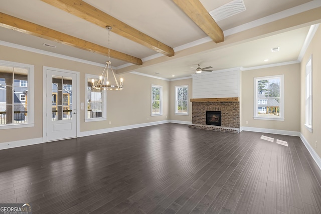 unfurnished living room featuring dark wood-style flooring, plenty of natural light, ceiling fan with notable chandelier, and beam ceiling