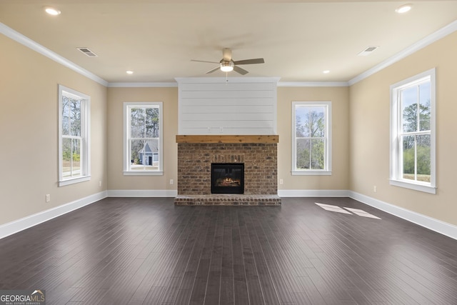 unfurnished living room with dark wood finished floors, ornamental molding, and visible vents