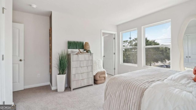 bedroom with carpet floors and baseboards
