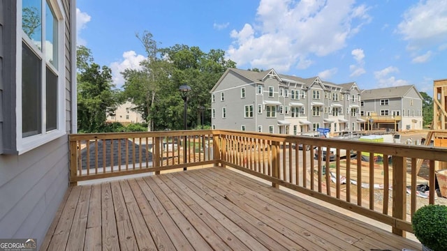 wooden deck featuring a residential view