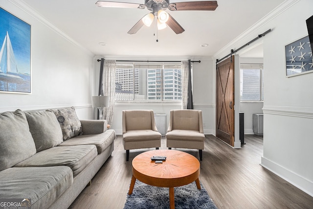 215 Piedmont Ave NE Unit 708, Atlanta, GA 30308 - living room with a barn door, crown molding, wood finished floors, and ceiling fan