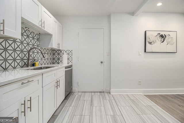 215 Piedmont Ave NE Unit 708, Atlanta, GA 30308 - kitchen featuring tasteful backsplash, light countertops, white cabinetry, recessed lighting, and dishwasher