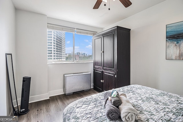 215 Piedmont Ave NE Unit 708, Atlanta, GA 30308 - bedroom with wood finished floors, a view of city, and ceiling fan