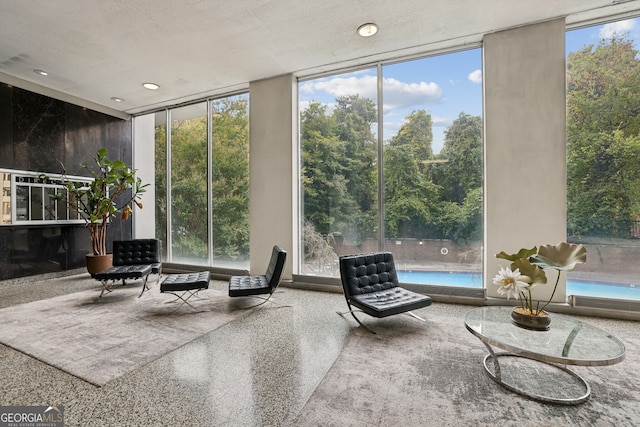 215 Piedmont Ave NE Unit 708, Atlanta, GA 30308 - sunroom with a wall of windows, plenty of natural light, and speckled floor