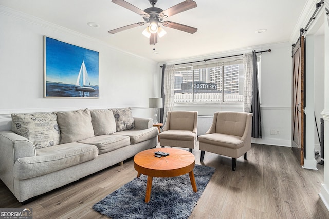 215 Piedmont Ave NE Unit 708, Atlanta, GA 30308 - living room featuring a barn door, ornamental molding, wood finished floors, ceiling fan, and recessed lighting