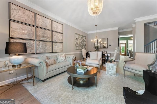 2630 Milford Ln, Alpharetta, GA 30009 - living area featuring a chandelier, ornamental molding, and wood finished floors