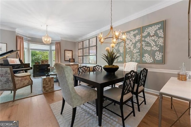 2630 Milford Ln, Alpharetta, GA 30009 - dining area featuring a chandelier, wood finished floors, and crown molding