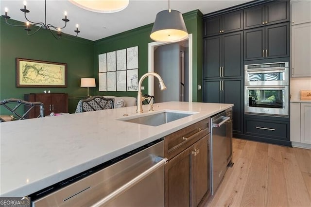 2630 Milford Ln, Alpharetta, GA 30009 - kitchen featuring appliances with stainless steel finishes, light countertops, light wood-style flooring, and open floor plan