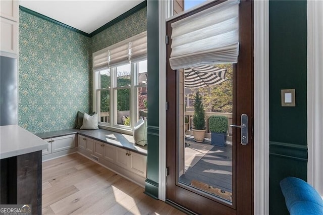 2630 Milford Ln, Alpharetta, GA 30009 - doorway with wallpapered walls, light wood finished floors, and crown molding