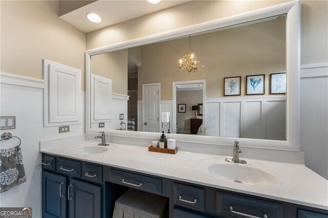 2630 Milford Ln, Alpharetta, GA 30009 - bathroom featuring double vanity and a chandelier