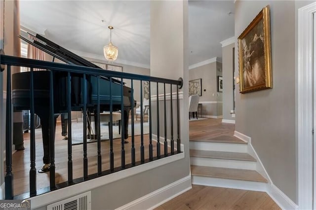 2630 Milford Ln, Alpharetta, GA 30009 - staircase with wood finished floors and ornamental molding