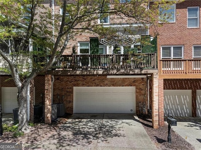 2630 Milford Ln, Alpharetta, GA 30009 - view of front of property with brick siding, an attached garage, and concrete driveway