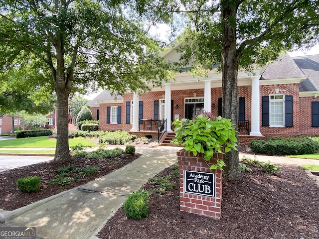 2630 Milford Ln, Alpharetta, GA 30009 - greek revival inspired property featuring brick siding, a porch, and roof with shingles