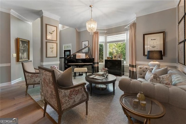2630 Milford Ln, Alpharetta, GA 30009 - living room featuring ornamental molding, wood finished floors, and a chandelier
