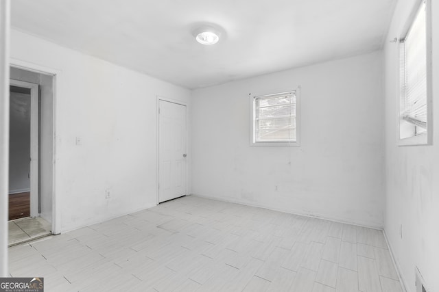 unfurnished room with visible vents and light wood-style flooring