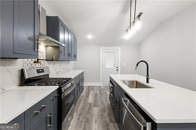 358 Roy St SW, Atlanta, GA 30310 - kitchen with appliances with stainless steel finishes, a sink, wall chimney exhaust hood, tasteful backsplash, and an island with sink
